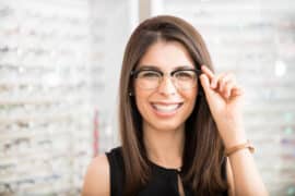 woman trying on eyeglasses