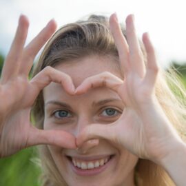 Woman making a heart with hands