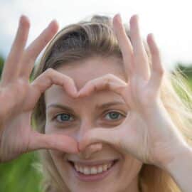 Woman making a heart with hands