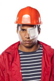 Man in hardhat with an eye injury