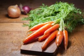 Carrots on a cutting board eye nutrition