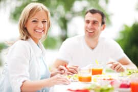 Happy people sitting at a table together